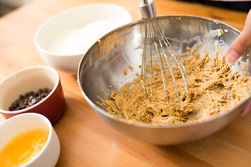 Image showing Mixing batter inside bowl