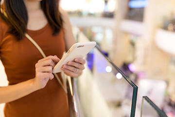 Image showing Woman use of mobile phone at shopping mall