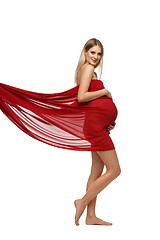 Image showing Pregnant girl in red dress