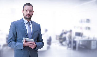 Image showing Young businessman in his office