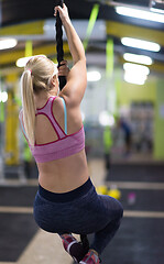 Image showing woman doing rope climbing