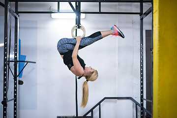 Image showing woman working out on gymnastic rings