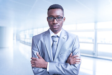 Image showing Young businessman in his office