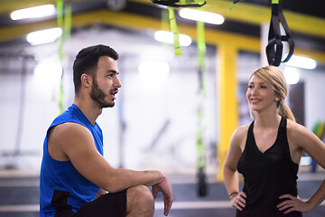 Image showing athletes working out  jumping on fit box