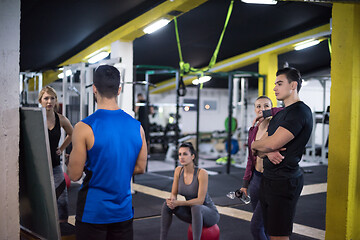 Image showing athletes getting instructions from trainer