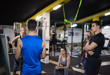 Image showing athletes getting instructions from trainer