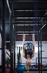 Image showing woman working out on gymnastic rings