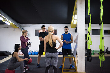 Image showing athletes getting instructions from trainer