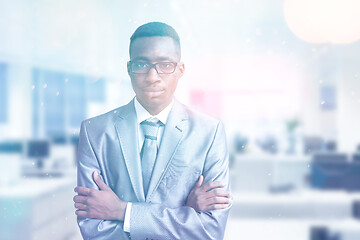 Image showing Young businessman in his office