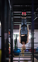 Image showing woman working out on gymnastic rings