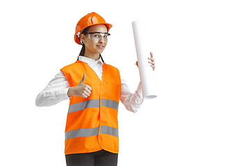 Image showing The female builder in orange helmet isolated on white