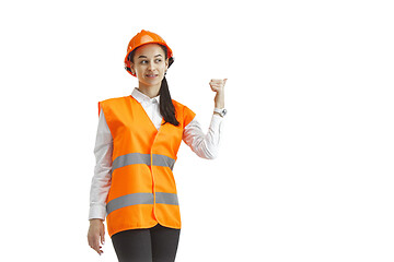 Image showing The female builder in orange helmet isolated on white