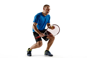 Image showing Portrait of a handsome male tennis player celebrating his success isolated on a white background