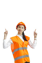 Image showing The female builder in orange helmet isolated on white