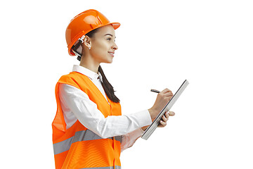 Image showing The female builder in orange helmet isolated on white