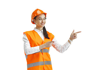 Image showing The female builder in orange helmet isolated on white