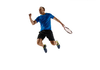 Image showing Portrait of a handsome male tennis player celebrating his success isolated on a white background