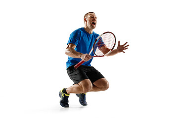 Image showing Portrait of a handsome male tennis player celebrating his success isolated on a white background