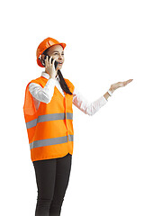 Image showing The female builder in orange helmet isolated on white