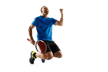 Image showing Portrait of a handsome male tennis player celebrating his success isolated on a white background