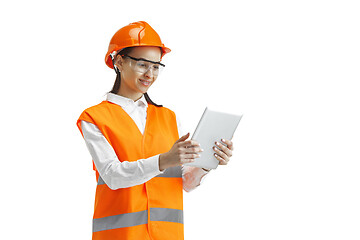 Image showing The female builder in orange helmet isolated on white