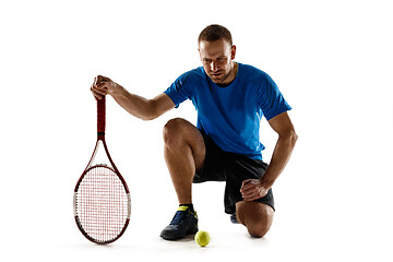 Image showing Tennis player crouching down looking defeated and sad