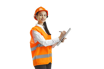 Image showing The female builder in orange helmet isolated on white