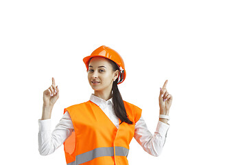 Image showing The female builder in orange helmet isolated on white