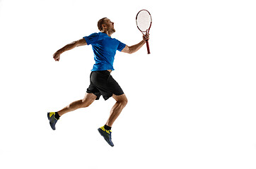 Image showing Portrait of a handsome male tennis player celebrating his success isolated on a white background