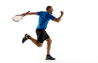 Image showing Portrait of a handsome male tennis player celebrating his success isolated on a white background