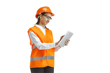 Image showing The female builder in orange helmet isolated on white