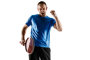 Image showing Portrait of a handsome male tennis player celebrating his success isolated on a white background