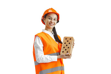 Image showing The female builder in orange helmet isolated on white