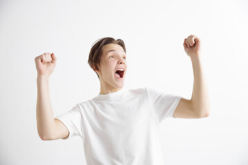 Image showing Winning success man happy ecstatic celebrating being a winner. Dynamic energetic image of male model