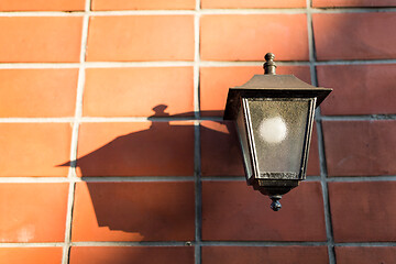 Image showing Street lamp on brick wall