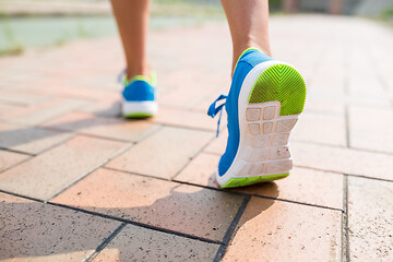 Image showing Woman jogging at city