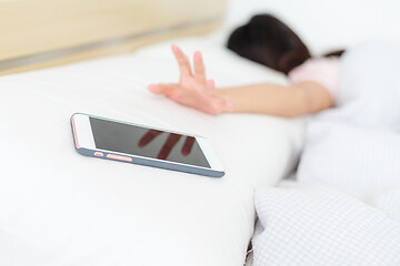 Image showing Woman try to get her cellphone