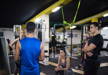 Image showing athletes getting instructions from trainer