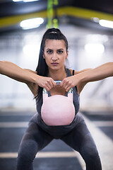 Image showing woman exercise with fitness kettlebell