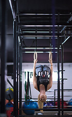 Image showing woman working out on gymnastic rings