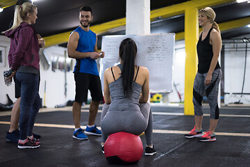 Image showing athletes getting instructions from trainer