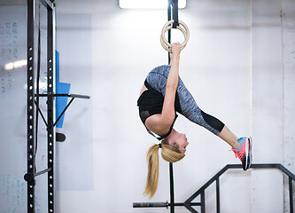 Image showing woman working out on gymnastic rings