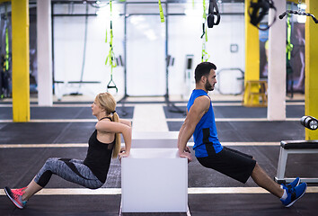 Image showing athletes working out their arms