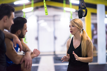 Image showing athletes working out  jumping on fit box