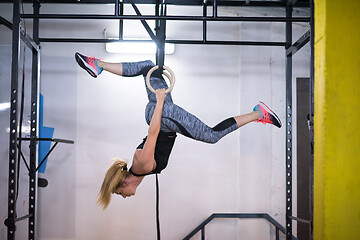 Image showing woman working out on gymnastic rings