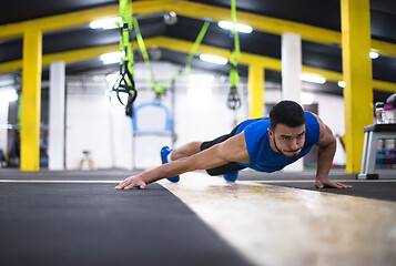 Image showing Young  man doing pushups