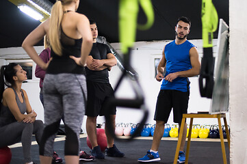 Image showing athletes getting instructions from trainer