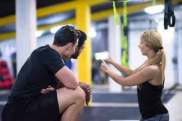 Image showing athletes working out  jumping on fit box