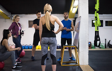 Image showing athletes getting instructions from trainer