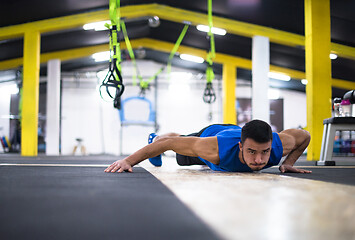 Image showing Young  man doing pushups